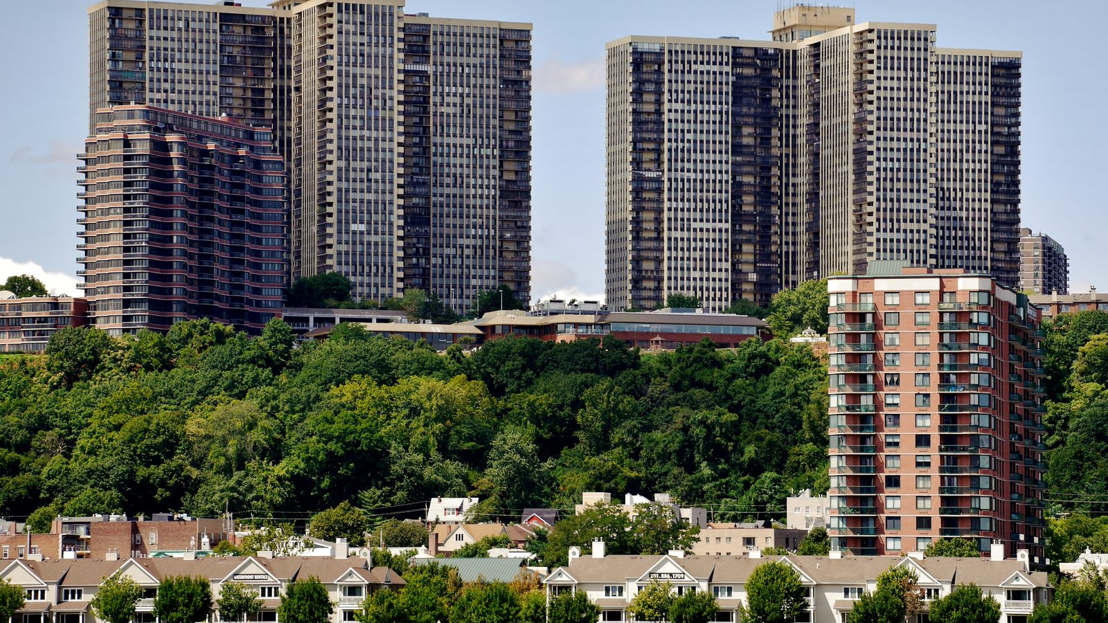 The Edgewater, NJ waterfront on the Hudson River, lined with residential and commercial high-rises along River Road