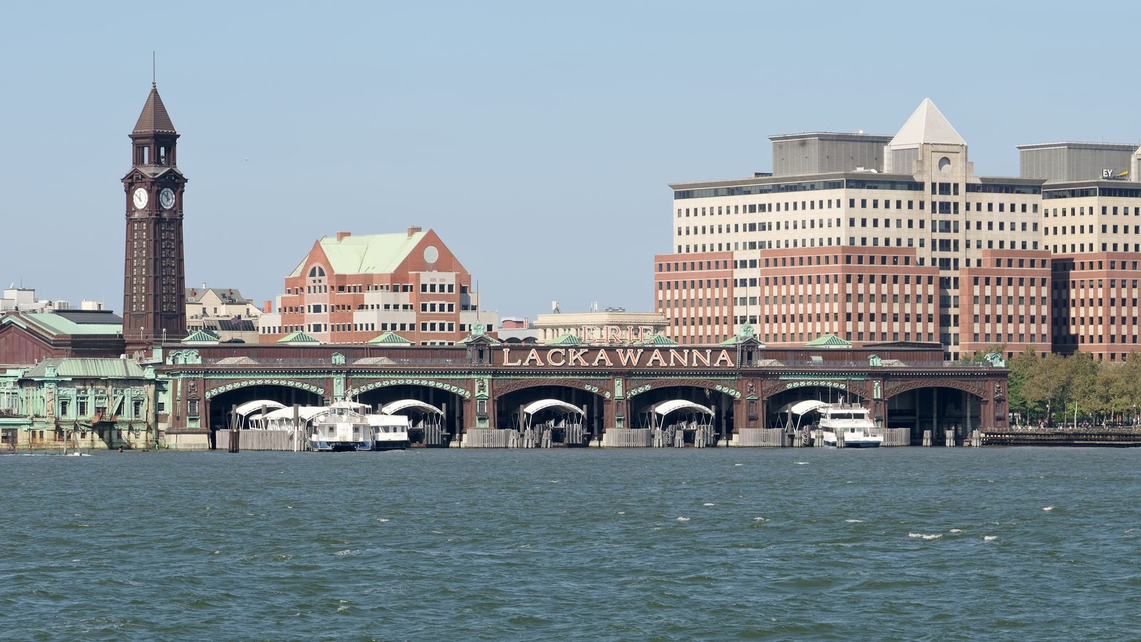 The 1907 Hoboken Terminal with its clock tower and ferry shed, seen from the Hudson River in Hoboken, NJ