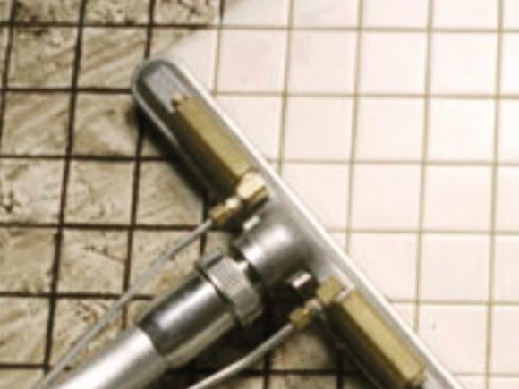 Steam wand lifting soil from a tiled floor. Same equipment we use on carpet, upholstery, and grout.